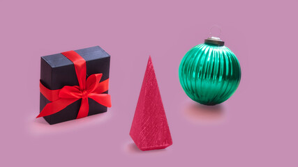 Christmas still life composition in Squid game style, circle ball, triangle wood tree and  square giftbox with  red lace.
