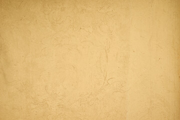 The texture of a yellow concrete wall. Beautiful texture background