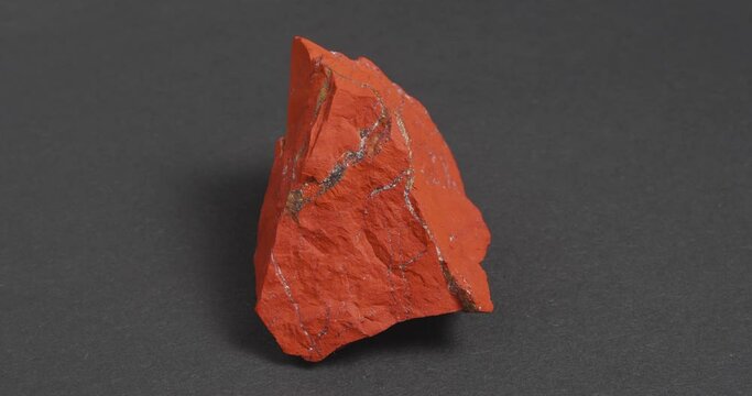 Jastic is red on a dark background. Semi-precious ornamental stone.