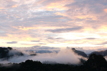 Beautiful mountain sunrise with sunlight and fog over northern Thailand's mountains