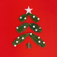 Obraz premium Creative Christmas pattern with green Christmas tree and snow, New Year composition. Minimal flat lay.