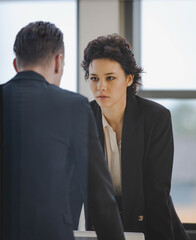 Caucasian business professional woman seriously listen to senior boss explaining job assignment of...