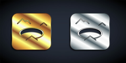 Gold and silver Winter fishing icon isolated on black background. Round ice frame. Hole in ice. Long shadow style. Vector