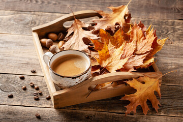 Naklejka na ściany i meble Autumn background with cup of black coffee and fall decoration