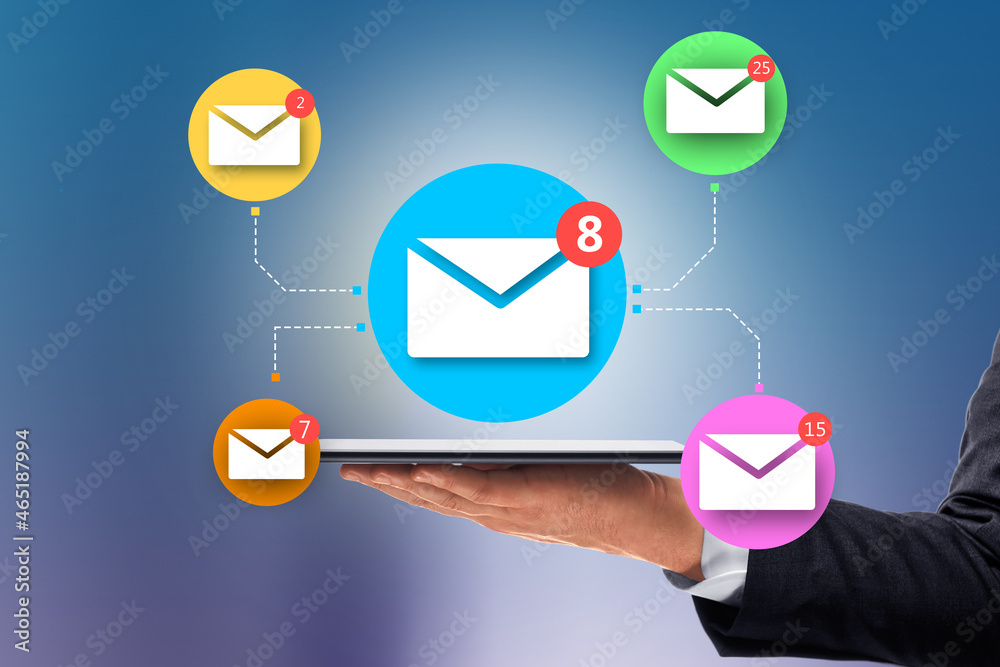 Poster Close up of businessman hand holding tablet with abstract email network on blue wall background. Social networking and communication concept.