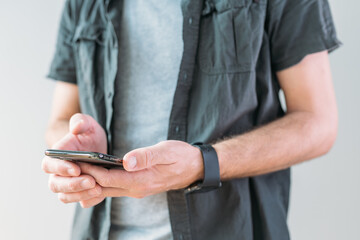 Casual man using smart mobile phone for communication