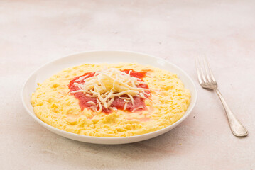 Polenta with tomato, cheese and mince