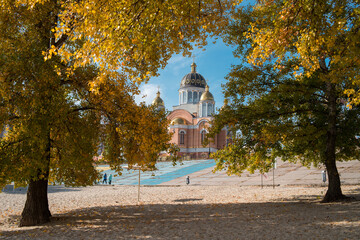 Orthodox church surrounded by golden autumn trees