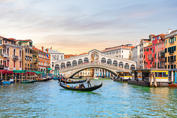 Rialto Bridge and gondoliers, a popular landmark of Venice, Italy