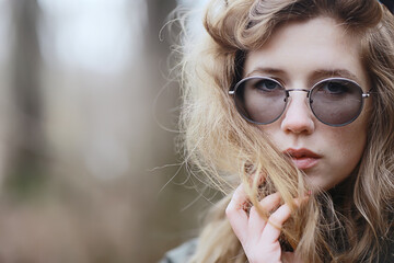 girl glasses autumn portrait, an adult woman glamorous autumn look