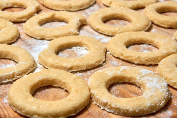Blank for making curd donuts in the form of rings and balls. Home cooking, dough products