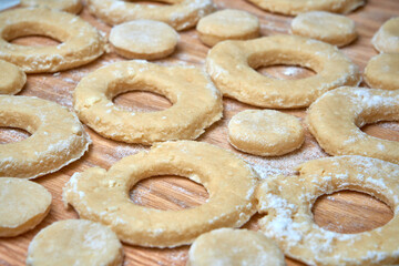 Blank for making curd donuts in the form of rings and balls. Home cooking, dough products