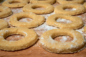 Blank for making curd donuts in the form of rings and balls. Home cooking, dough products