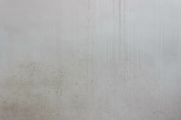 Old ugly wall covered with cement. Texture with beautiful dirt streaks and spots of dirt

