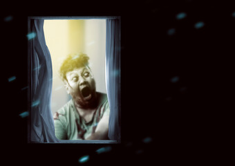 Scary zombie with blood and wound on his body standing