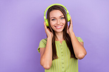 Photo of charming nice positive woman headphones music lover good mood isolated on violet color background
