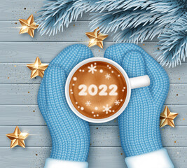 Hands in knitted mittens holding a cup of coffee. New Year greeting card template