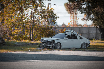 premium car after an accident is on the side of the road, a broken car