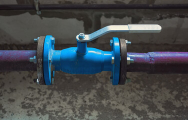 Natural gas transportation pipe with a ball valve on it with an open straight steel lever