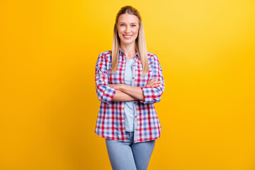 Photo of optimistic blond agent lady crossed arms wear blue shirt isolated on yellow color background