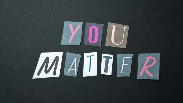 You matter words. Caption, heading made of letters with different fonts on a dark background.