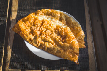 two chebureks with meat on a plate
