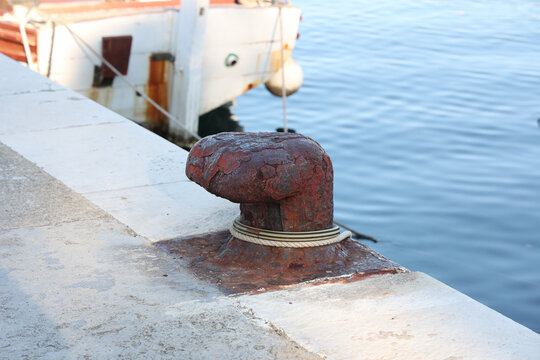 Bollard With A Mooring Line Wrapped Around It.