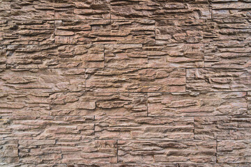 Light brown stone wall, beautiful backdrop of stone blocks