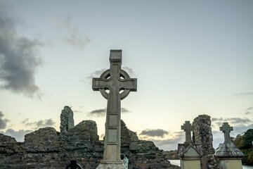 The sun is setting above the Abbey Graveyard which was build by Hugh O Donnell in 1474 - all names...