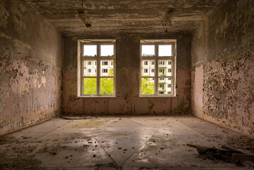 Fototapeta na wymiar Large window in a ruined house, inside view