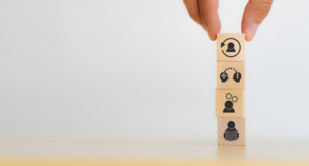 New skill development for business adaptation of technology and digital transformation. Changing skill demand. Hand hold wood cubes re-skill icon with self learning, coaching, knowledge sharing icon.