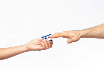 Close up of Finger and hand in an Oximeter Device. Pulse oximeter on white background. covid