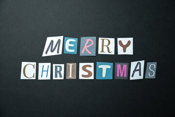 Merry christmas words. Caption, heading made of letters with different fonts on a dark background.