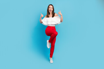 Fototapeta premium Full body photo of positive young happy cheerful lady lift thumb up good mood isolated on blue color background