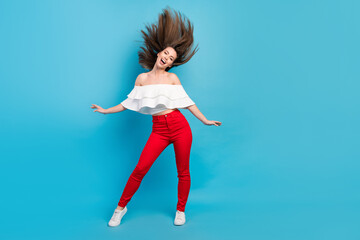 Full length body size view attractive cheerful careless girl throwing hair having fun isolated over...