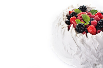 Delicious Pavlova cake with meringue topped and fresh berries isolated on white background. Copy space	