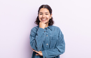 pretty teenager woman smiling, enjoying life, feeling happy, friendly, satisfied and carefree with...