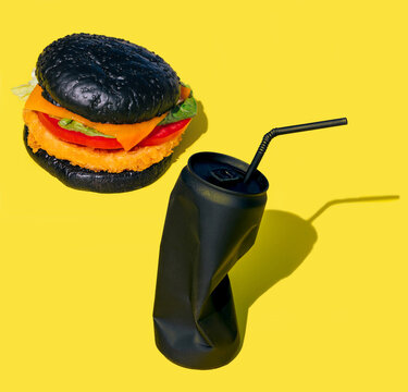 Burger and can of soft drink