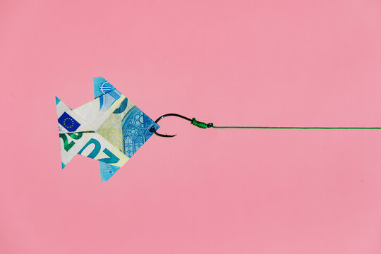 Origami money fish on hook