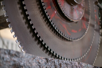 Big industrial machine cutting stone in a factory