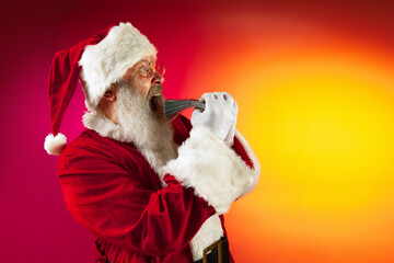 Portrait of emotional Santa Claus wishes wealth and prosperity to every family in New Year 2022. Holidays concept