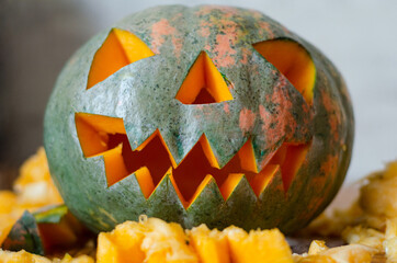 scary smiling pumpkin halloween lantern on table