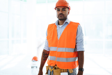 Portrait of young construction engineer wearing hardhat