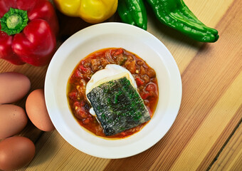 Delicious dish of fresh hake with fresh peppers and vegetables. Typical hemp plate of the cantabrian. Gourmet dish of fresh fish and vegetables.