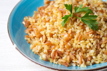 Traditional delicious Turkish food, bulgur pilaf with vermicelli (Turkish name; arpa sehriyeli bulgur pilavi)