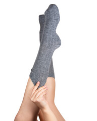 Gray warm high socks on woman legs elegant isolated on the white background