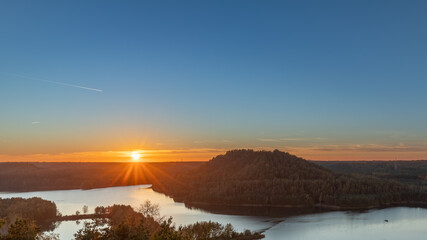 Obraz premium Sunset over the hills of a former coal mine near the Belgium city of Maasmechelen. This area has been redesigned into an amazing national park with spectacular wide views over the area