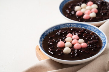 Red and white tangyuan with red bean soup.