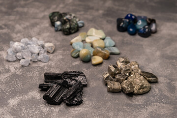 Semi precious gem stones collection. Different shapes sea rock pebbles. Colorful rocks. Close up of different kinds of stones in a variety of colours. Texture of different types of stones. Gemstones