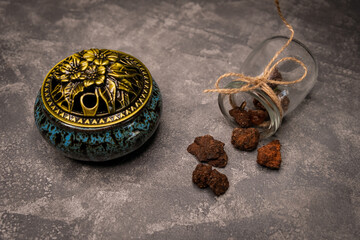Ceramic incense burner for aromas. Incense burner, aromatic candle on table. Zen, Religion concept....